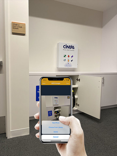 User taking a photo of an AED with PulsePoint AED for the community registry.